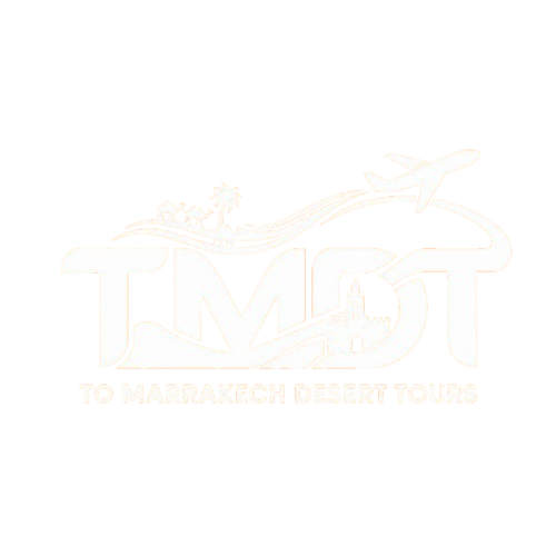 The official white logo of To Marrakech Desert Tours set against a solid orange background, featuring the large letters TMDT integrated with an airplane, a camel caravan, a palm tree, and a traditional Moroccan minaret fortress.