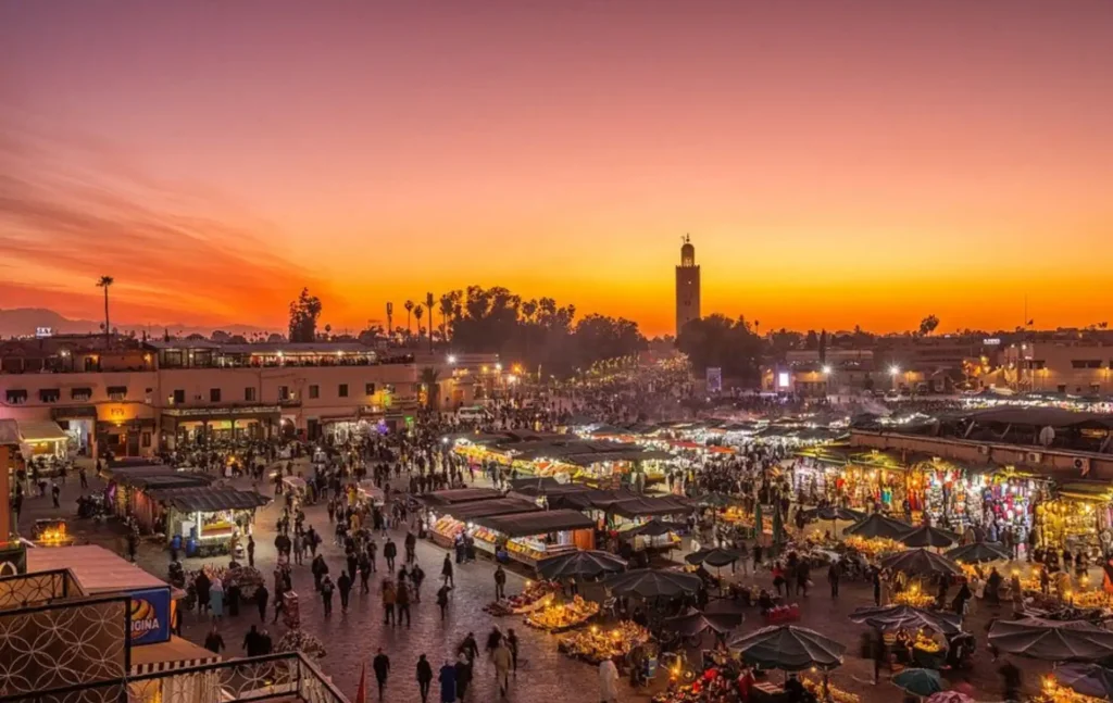 The vibrant Jemaa el-Fnaa square in Marrakech at sunset, the final stop on our 12 day Morocco itinerary.