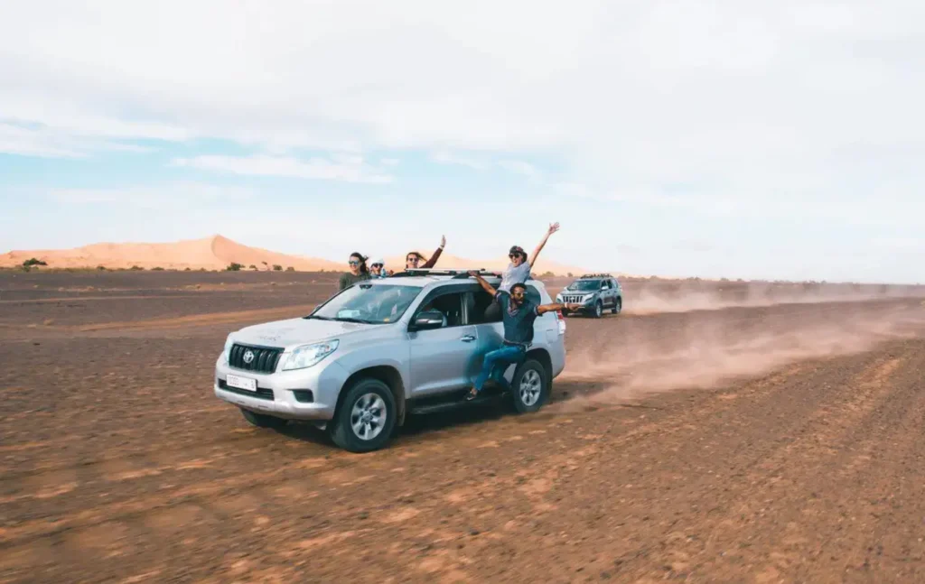 Travelers enjoying a Merzouga desert excursion during their Merzouga desert tours.