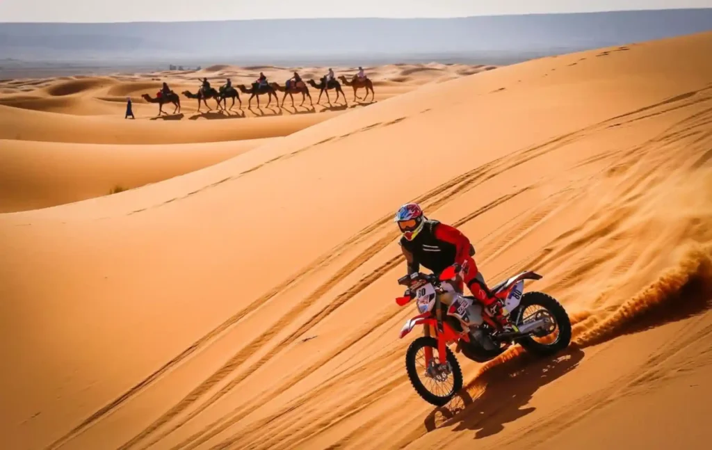A rider skillfully drifting through the vast Erg Chebbi dunes during an exhilarating ktm merzouga tour in Morocco.