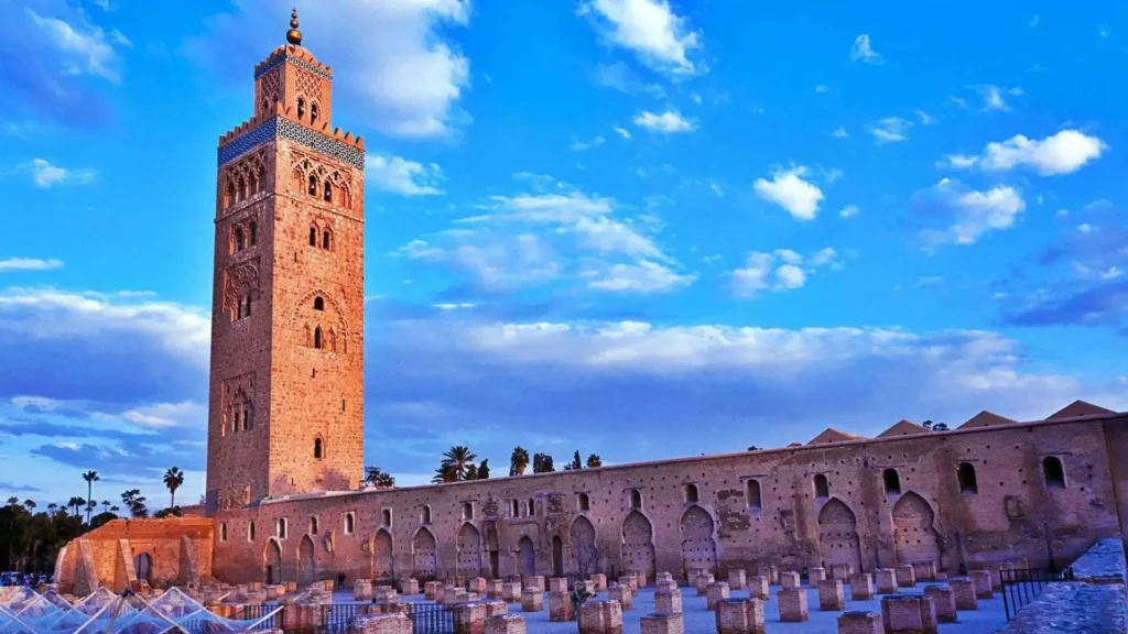 Things to do in Marrakech visiting the ancient stone ruins and minaret tower of the iconic Koutoubia Mosque