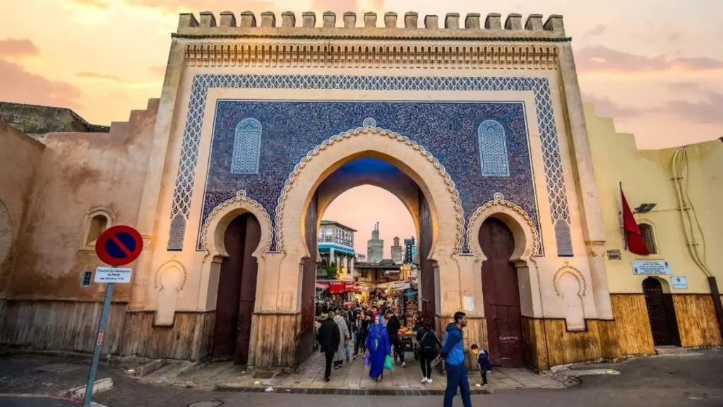 Best way to travel from Portugal to Morocco catching a direct flight to visit the historic Bab Bou Jeloud gate in Fes