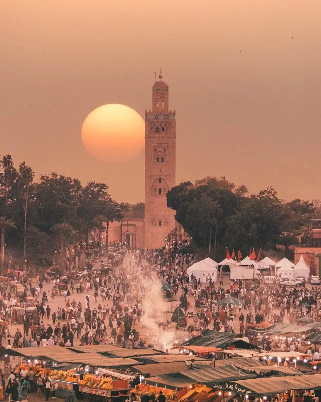 Where is Morocco Marrakech located showing Jemaa el-Fnaa square and Koutoubia Mosque at sunset